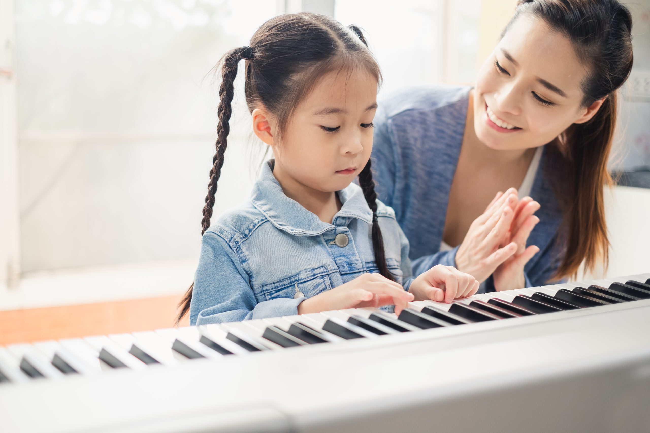 Piano teacher teaching a child in upper east side in new york city